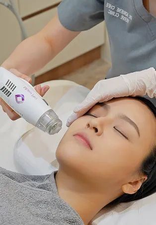 Matrix RF microneedling handpiece being used on a patient's face