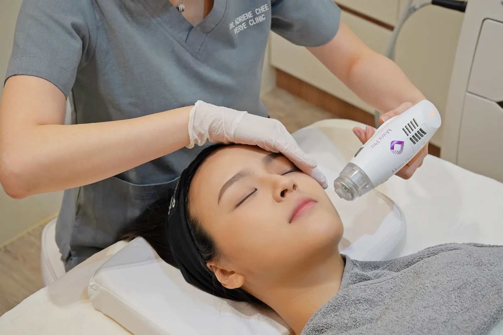 Close-up of the Matrix Pro RF microneedling handpiece on a patient's cheek at Verve Clinic